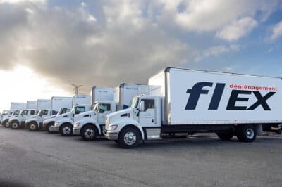 Flotte de camions bien entretenus de Flex Déménagement, prête pour les livraisons commerciales et résidentielles. / Flex Moving's well-maintained truck fleet, ready for commercial and residential deliveries.